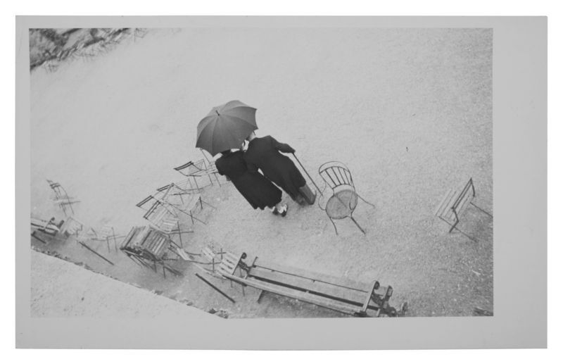 Parc des Tuilleries (Couple With Umbrella) Lot Sold  6,985 USD, Album: «On the Road» by Robert Frank from the Collection of Arthur S. Penn