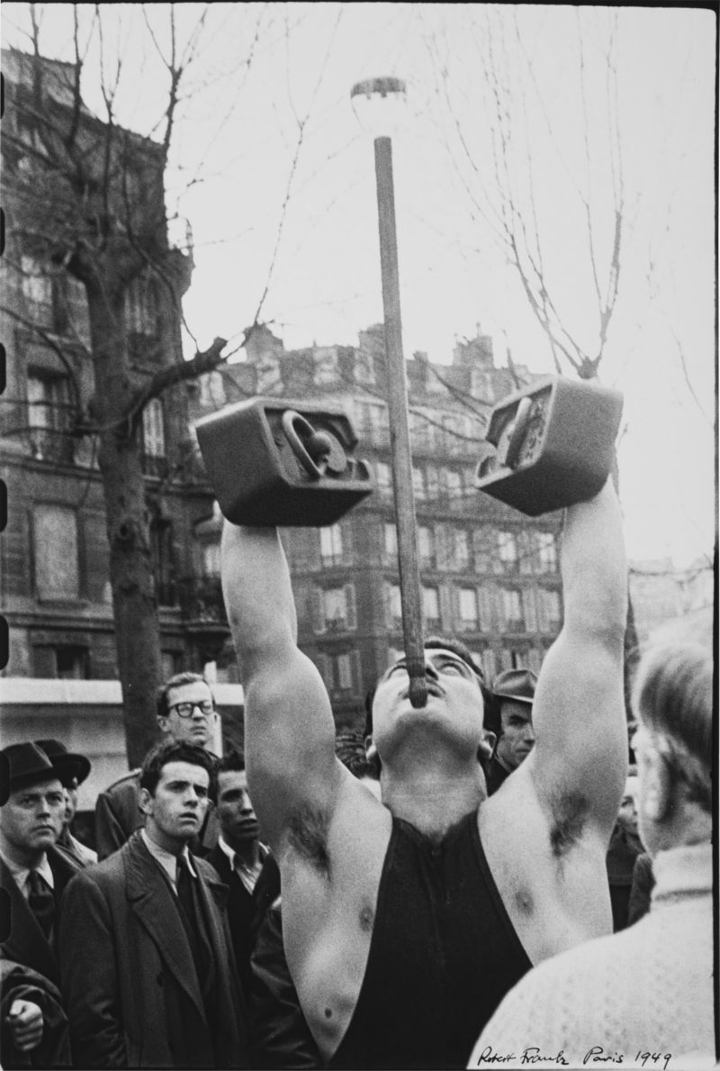 'Paris' (Street Performer) Estimate  20,000 - 30,000 USD, Album: «On the Road» by Robert Frank from the Collection of Arthur S. Penn