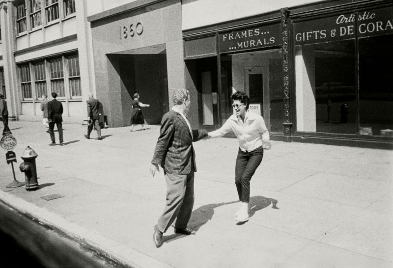 'From the Bus NYC' (Woman and Man on the Sidewalk) Lot Sold  63,500 USD, Album: «On the Road» by Robert Frank from the Collection of Arthur S. Penn