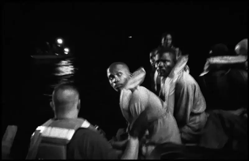 44 Haitians attempt to sail from Haiti to the United States in a 23-foot homemade wooden boat named the 'Believe in God.' As the boat sinks, the coast-guard board the boat to rescue its passengers © Christopher Anderson, Album: Christopher Anderson, Haiti. Immigrants Trip to America.